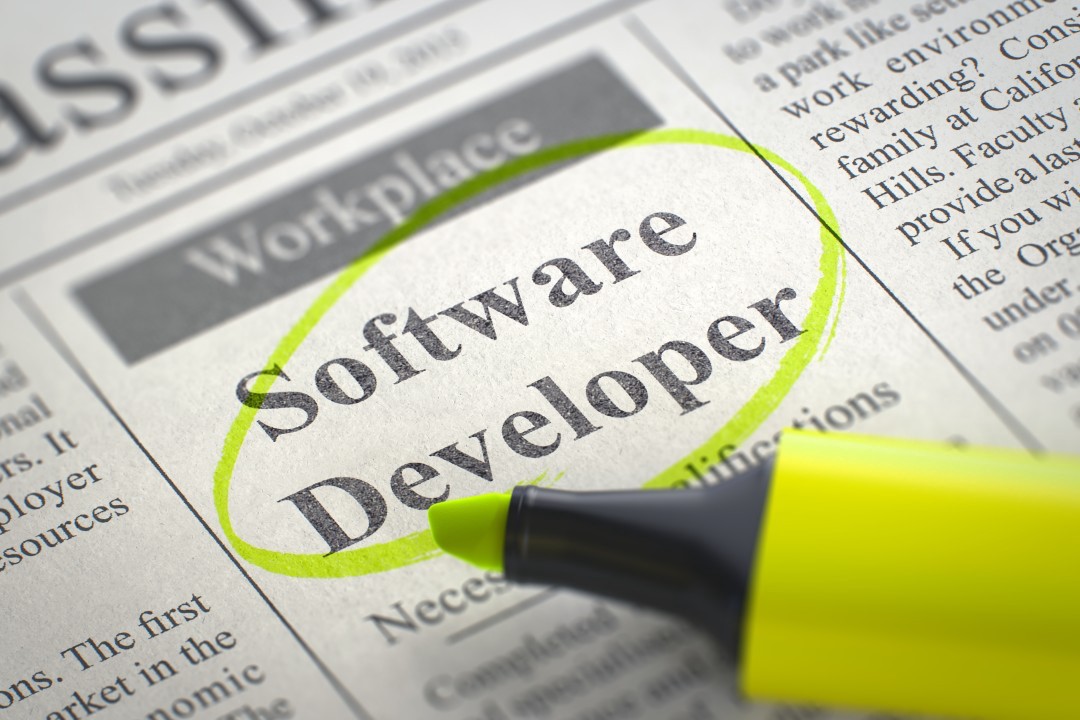 1RYx-wL56DyYwwoRR0x5-FA Newspaper ad circled in yellow highlighter for a Software Developer position